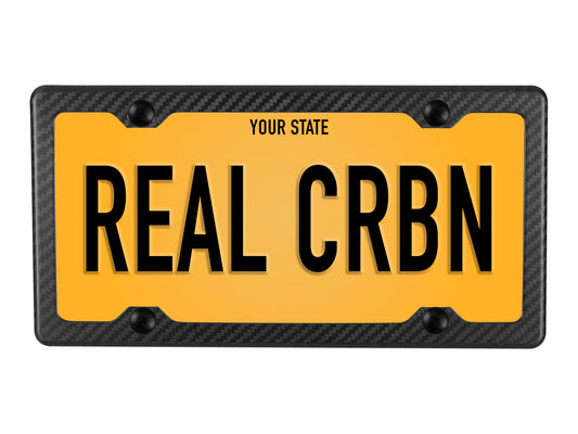 Sample plate display showcasing matte carbon fiber frame's minimalist borders and understated elegance